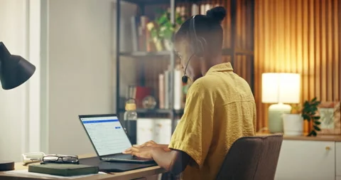 Headset, laptop screen and black woman in home office for technical support, Stock Footage 337289690