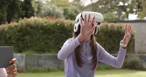 Headset projecting controls after session start while finger gestures selecting Stock Footage 336715457