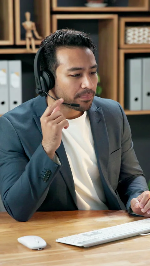 Headset, talking and business man on computer for finance consulting, investment Stock Footage 344311312
