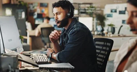 Headset, tech support and man in call center with computer, online advice and Foto stock