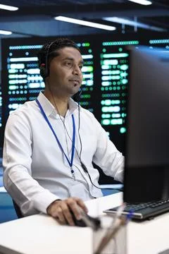 Headset, technician and communication with computer work in data center Stock Photos