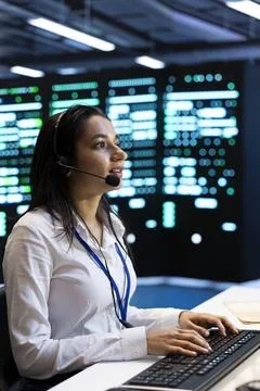 Headset, technician and communication at data center for technical support Stock Photos