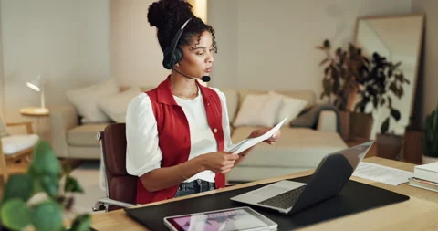 Headset, woman and virtual assistant with documents in home for remote work with Stock Footage 336843145