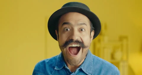 Headshot of amazed hispanic young man with a mustache and wear a head looking at Stock Footage 171446568