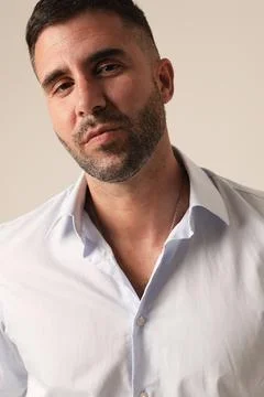 Headshot of bearded young man posing on white background. Vertical mock-up. Photos