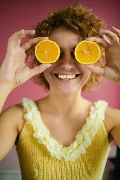 Headshot Of Beautiful Blonde Woman Holds Juicy Lemon Slices Has Healthy Stock Photos