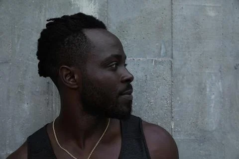 Headshot of Black man doing workout outdoors, with amazing sunset on background. 스톡 사진