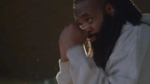 Headshot of Diverse Man with Dreadlocks and Beard Shadow Boxing in Bright Stock Footage 270398102