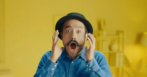Headshot of expressive hispanic man with a mustache looks shocked looking at Stock Footage 171372863
