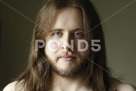 Headshot of long-haired man Stock Photos