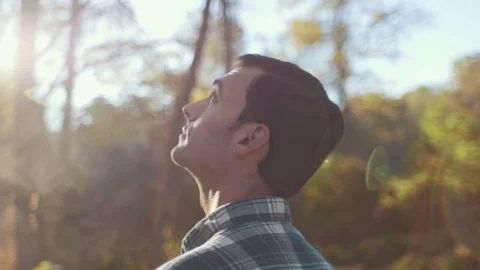 Headshot of Man Observing Forrest During Morning Sunrise (Steadicam Orbit) Stock Footage 81492057