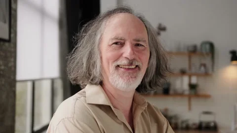 Headshot portrait of an elderly gray-haired man with a beard and long hair 60 Stock Footage 237706763