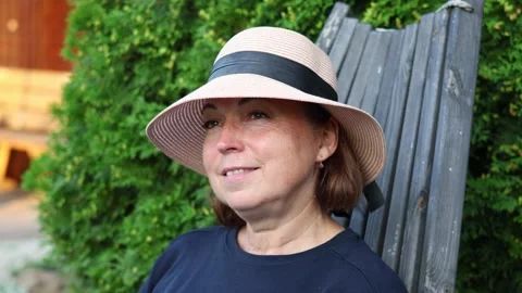 Headshot profile of pretty middle aged woman in the hat Stock Footage 288241867