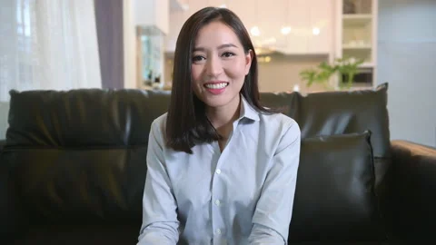 Headshot screen view of  young asian woman is using laptop computer to Video Stock Footage 138708010