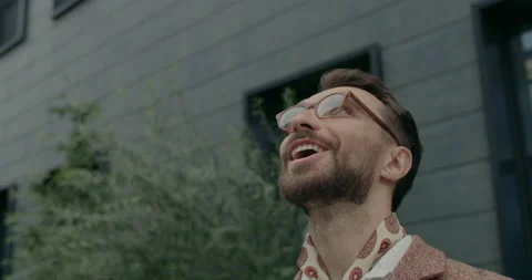 Headshot of stylish guy in glasses looking up and saying wow. Crop view of Video stock 144723562