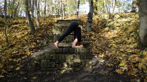 Headstand in autumn Stock Footage 72978483