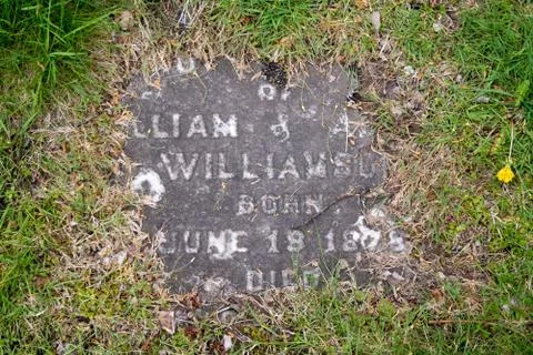 Headstone in ground Stock Photos
