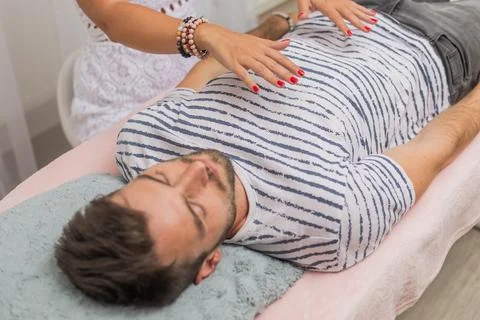 The healer performs the access bars therapy and touching to 32 points for Stock Photos