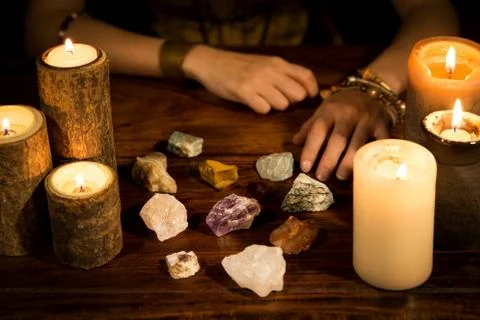 Healing stones, candles and fortune teller hands, concept life coaching Stockfoto's