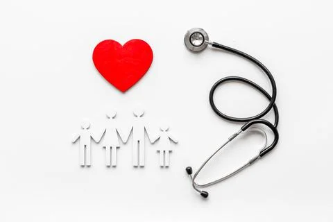 Health and medical care concept. Family figure with heart Stock Photos