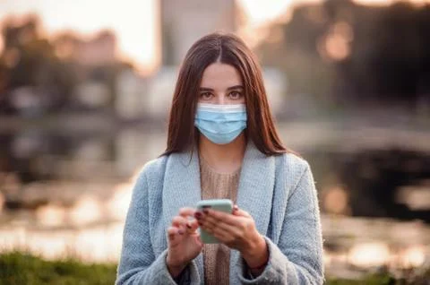 Health care and pandemic concept - dark haired Caucasian teenage girl student Stock Photos