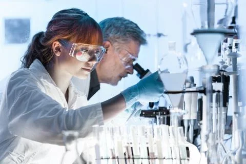 Health care researchers working in scientific laboratory Stock Photos