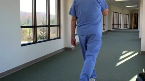 Health care worker getting good news on phone Stock Footage