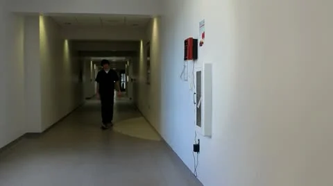 Health care worker using time clock Stockbeeldmateriaal 12532860