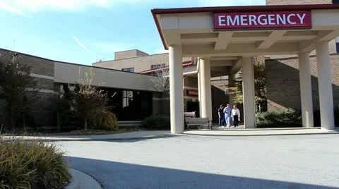 Health care workers walking out of emergency room Stock Footage