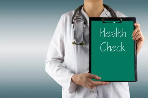 Health Check - Female doctor's hand holding medical clipboard and stethoscope Photos