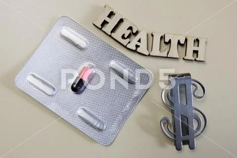 HEALTH inscription curve. The only pill in the blister and the dollar symbol. Stock Photos
