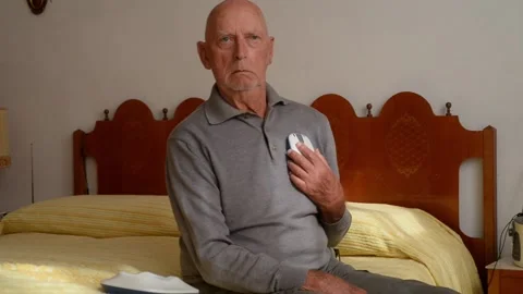 Health technology. The elderly man uses an electronic meter Stock Footage 218378846