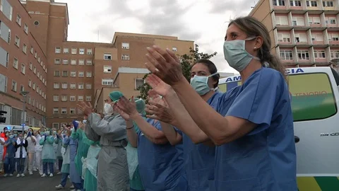 Health workers appreciate the signs of affection from their neighbors. Stock Footage