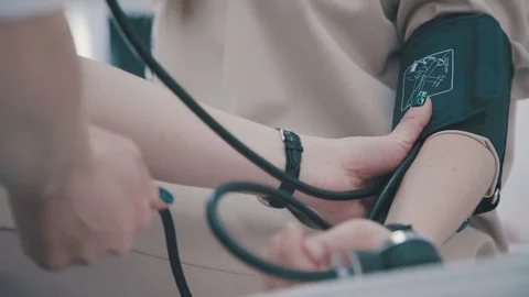 Healthcare and diagnostics concept. Checking blood pressure Stock Footage
