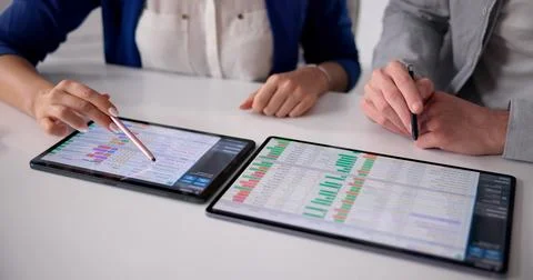 Healthcare Coder Analyzing Billing Data On A Tablet Device Stock Photos
