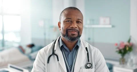 Healthcare, doctor and black man with arms crossed at hospital with smile for Stock Photos