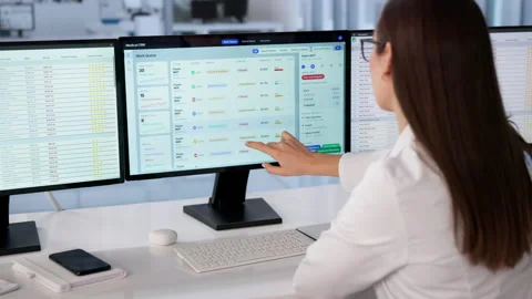 Healthcare Manager Efficiently Using CRM Software Stock Footage 333842572