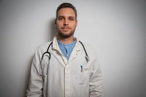 Healthcare practitioner standing in the studio with a stethoscope at his neck Stock Photos