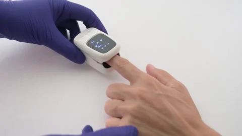 Healthcare Professional Using Pulse Oximeter to Measure Blood Oxygen Stock Footage 342278199
