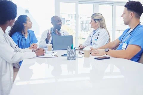 Healthcare, teamwork and black man in meeting, doctors and conversation for Stock Photos