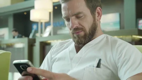 Healthcare worker using smartphone Stock Footage 75200441