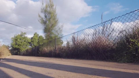 Healthy &amp; active couple running / jogging in slow motion in a park Stock Footage 132236068