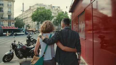 Healthy active elderly couple walk with their arms around each other downtown. Stock Footage 112058914