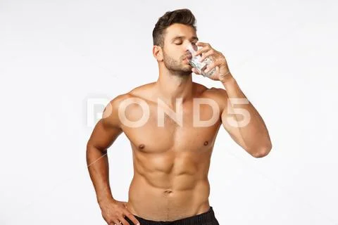 Healthy, active lifestyle and fitness concept. Charming, sexy male fitness Stock Photos