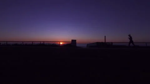 Healthy &amp; active person running / jogging at the Beach at Sunrise Stock Footage 132304959