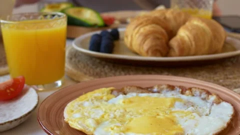 A healthy and appetizing breakfast of scrambled eggs, freshly baked vegetables Stock Footage 208444599