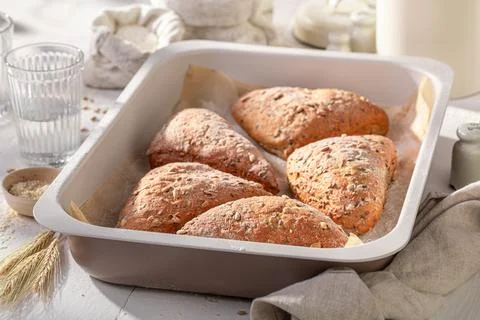 Healthy and hot triangular rolls in rustic bakehouse. Stock Photos