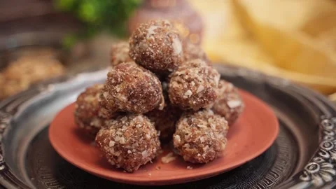 Healthy and nutrient dense snack dry fruit laddu in a clay plate. Stock Footage 282567435