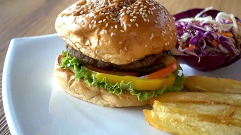 Healthy appetizing beef burger with keto gluten free bun, melted cheese, food, Stock-Footage 336578863