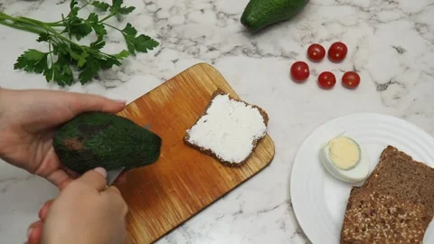 Healthy avocado toasts with rye bread, sliced avocado, eggs, cottage cheese, pum Stock Footage 272157978